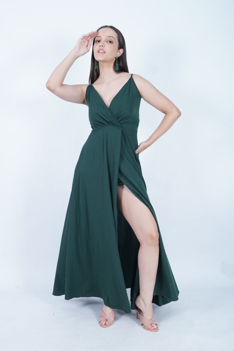 olive green dress with red shoes Beautiful Woman in a Green Dress and Red Shoes with Red Roses Stock Image