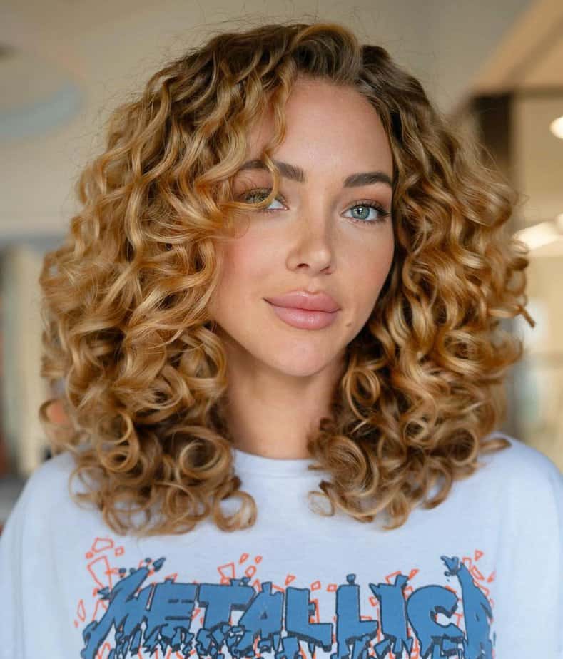 17. Soft honey blonde curls with effortless shine