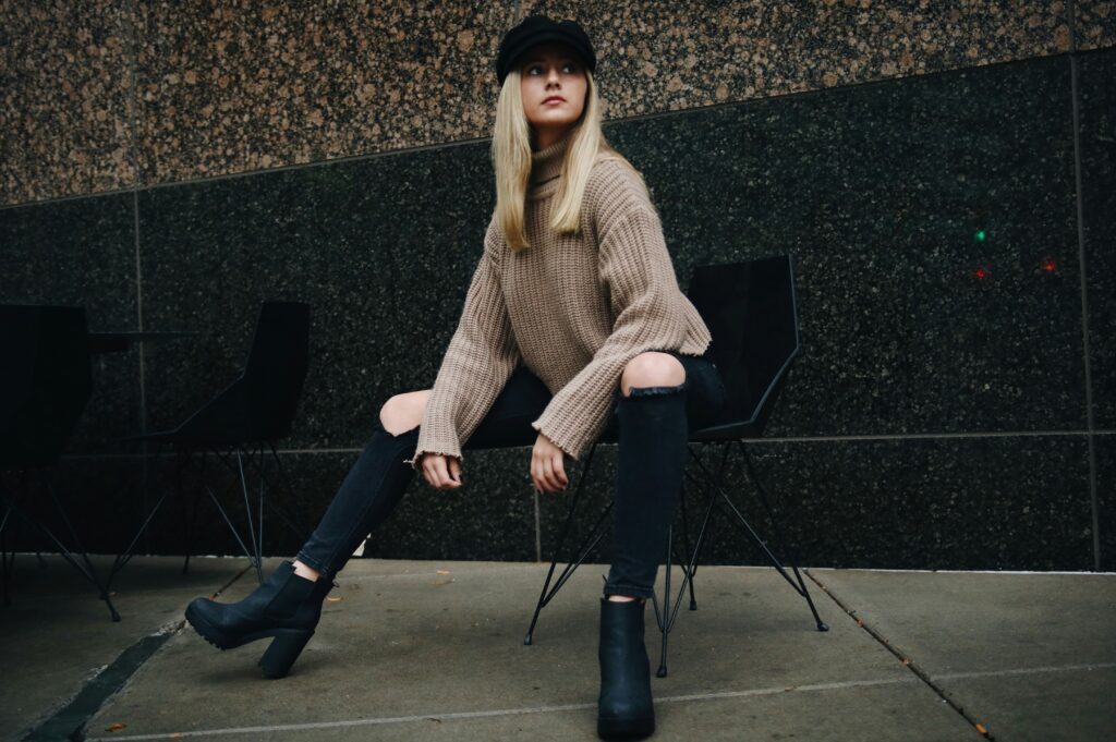 Oversized Sweater with Ripped Jeans and Heeled Black Boots