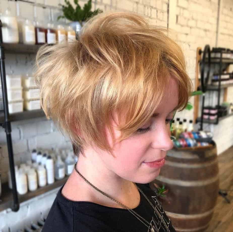 Strawberry blonde pixie bob haircut